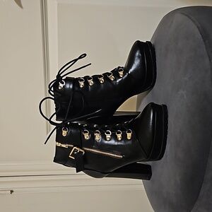 Black high heeled booties with zipper